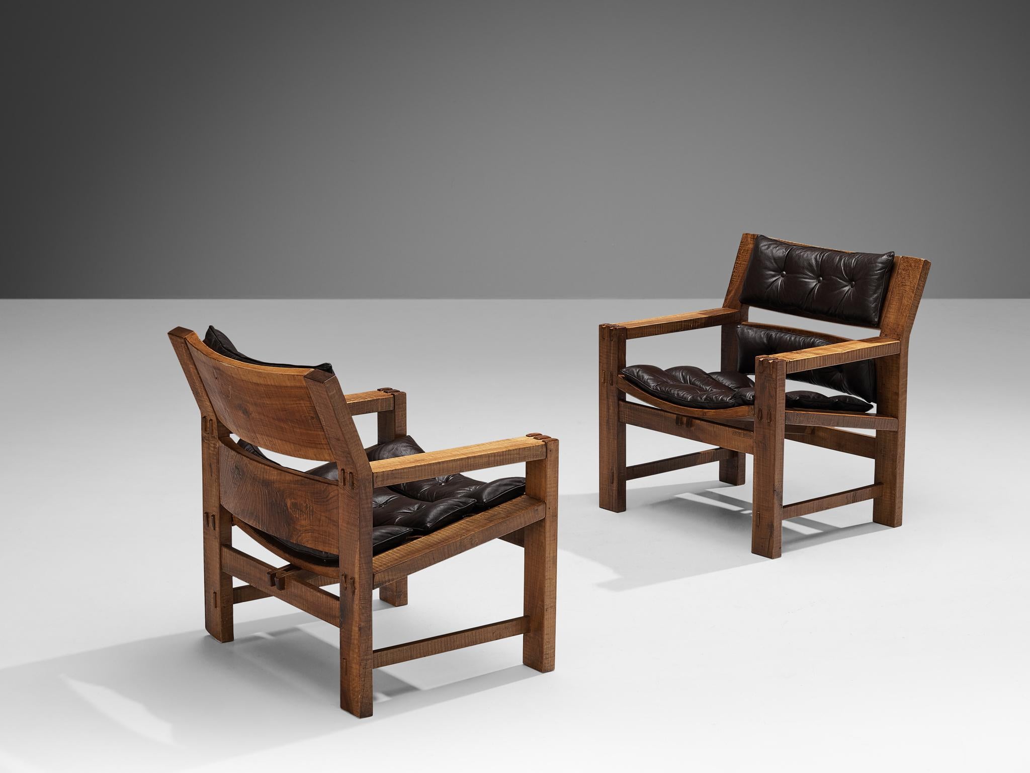 Giuseppe Rivadossi for Officina Rivadossi, pair of lounge chairs, walnut, leather, Italy, 1980s

A beautiful set of lounge chairs by the Italian sculptor and designer Giuseppe Rivadossi, featuring a high level of craftsmanship in woodwork. The