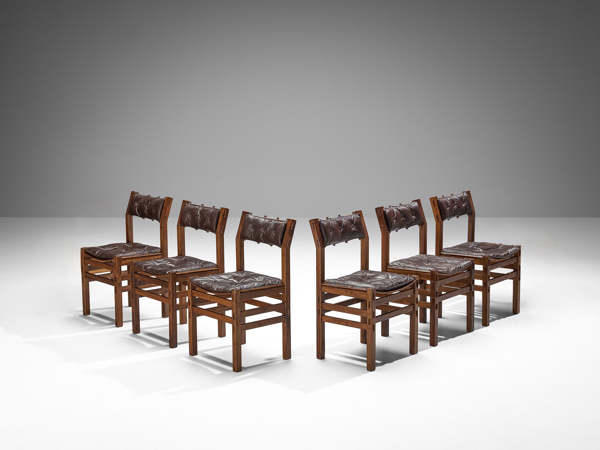 Giuseppe Rivadossi for Officina Rivadossi, set of six dining chairs, walnut, leather, Italy, 1970s

An exceptional set of chairs by the Italian sculptor and designer Giuseppe Rivadossi, featuring a high level of craftsmanship in woodwork. The chairs
