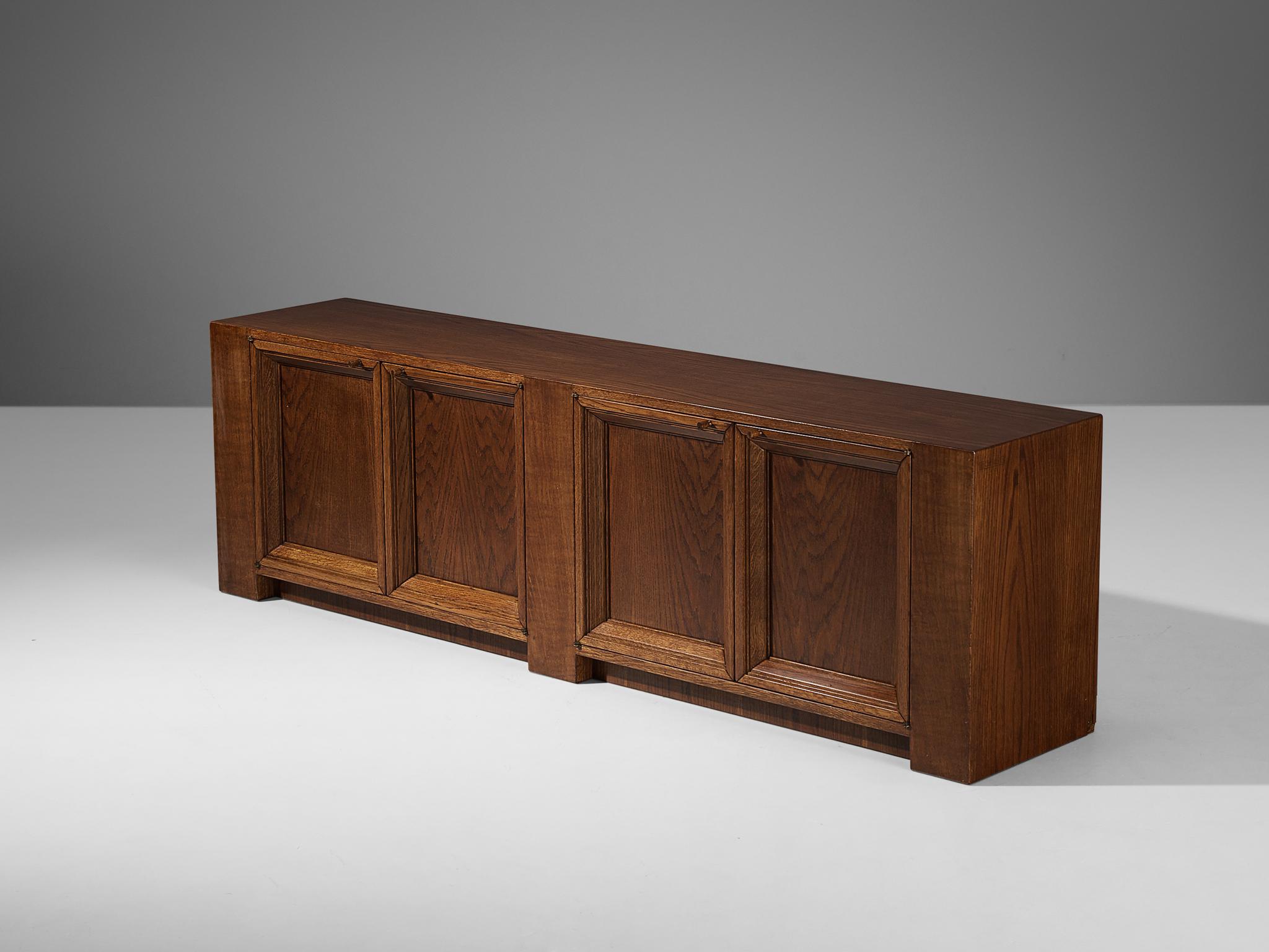 Giuseppe Rivadossi for Officina Rivadossi, sideboard, oak, Italy, 1980s

Giuseppe Rivadossi once again proves his great eye for materialization and technicality that this design is exemplary for. The sideboard is constructed using wooden panels