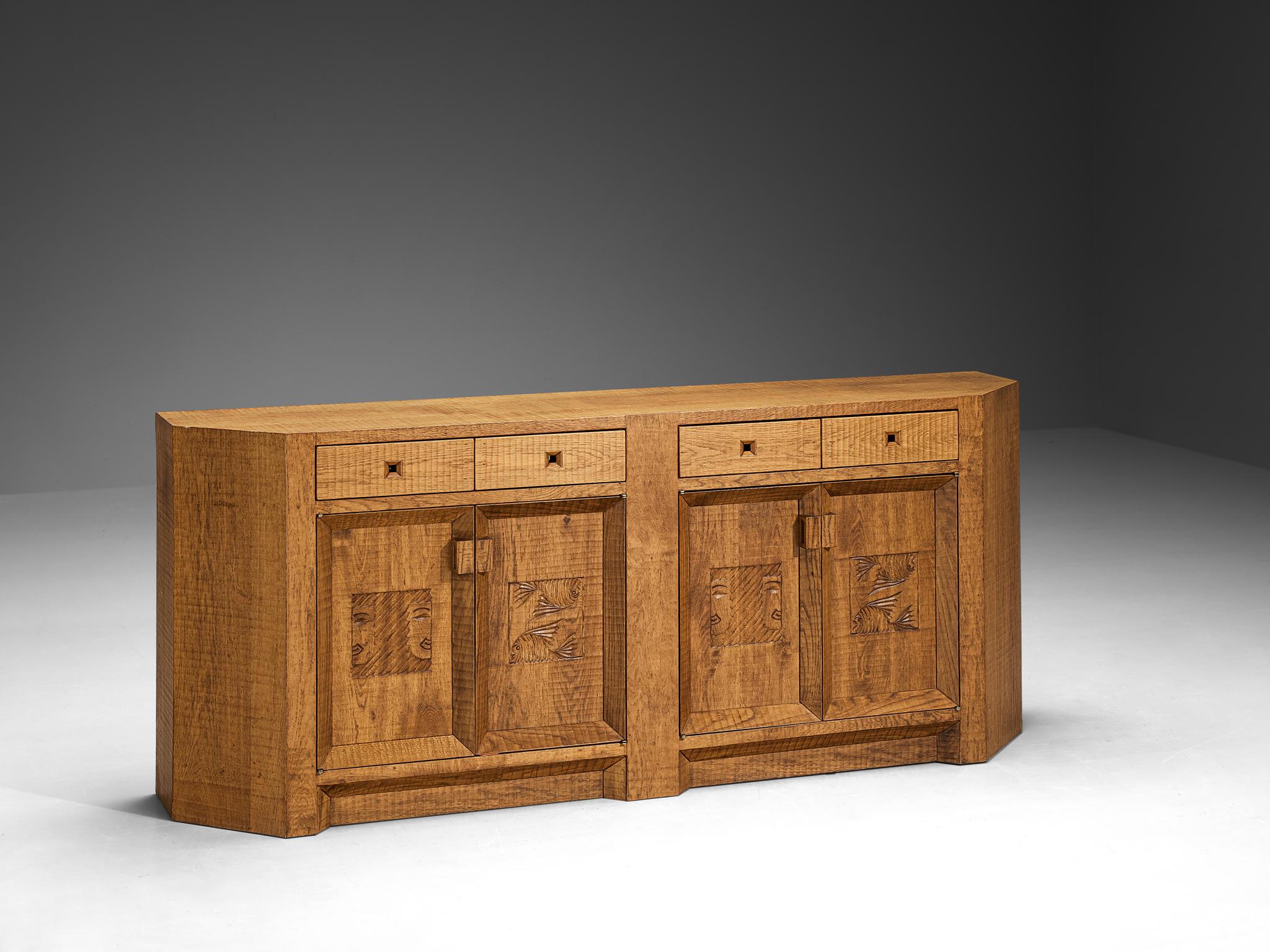 Giuseppe Rivadossi for Officina Rivadossi, sideboard, oak, glass, Italy, 1970s/80s

An exceptional credenza by the Italian sculptor and designer Giuseppe Rivadossi, featuring a high level of craftsmanship in woodwork. The doorpanels feature visually