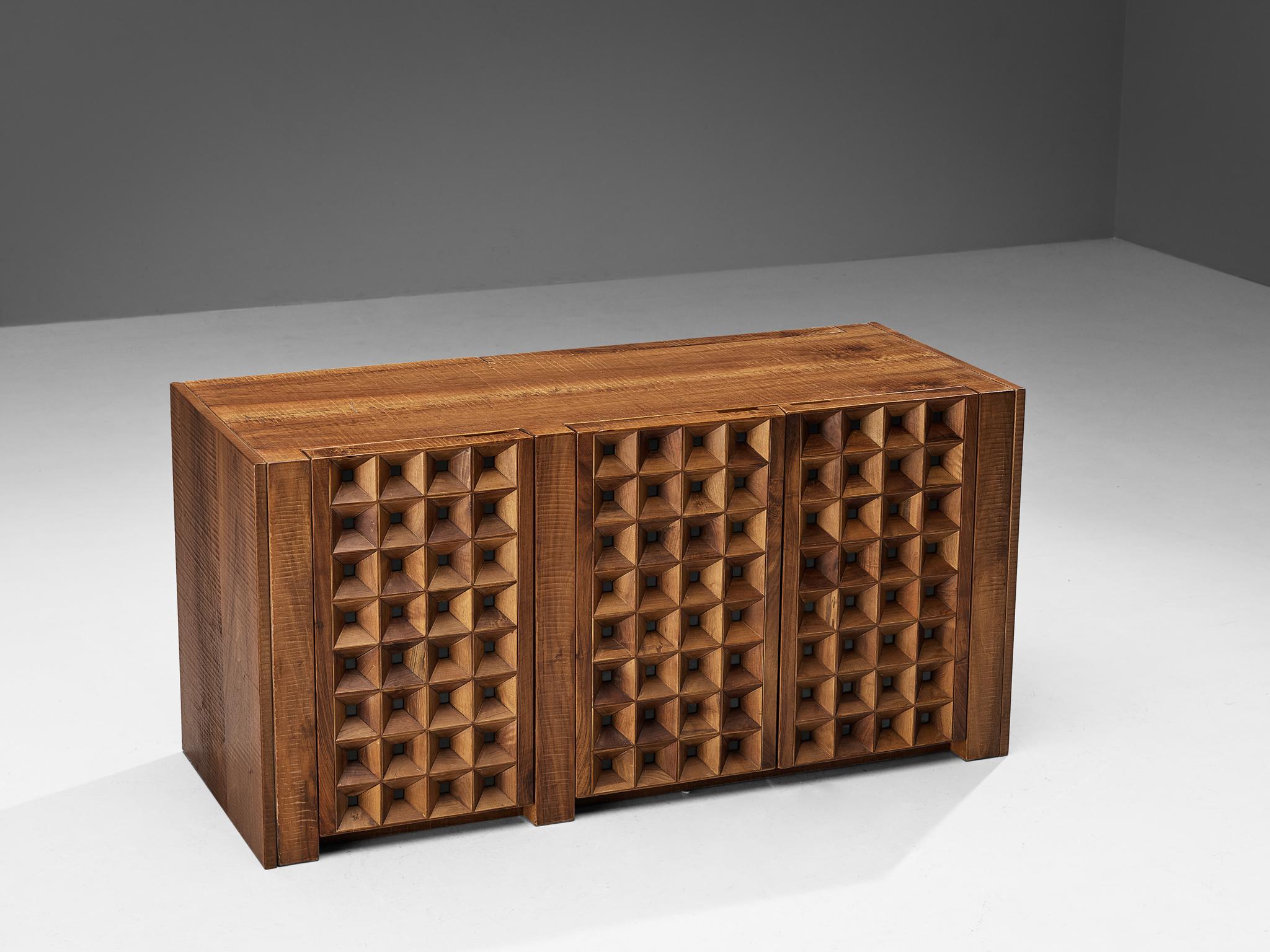 Giuseppe Rivadossi for Officina Rivadossi, sideboard, walnut, Italy, 1980s

An exceptional credenza by the Italian sculptor and designer Giuseppe Rivadossi, featuring a high level of craftsmanship in woodwork. The door panels feature square