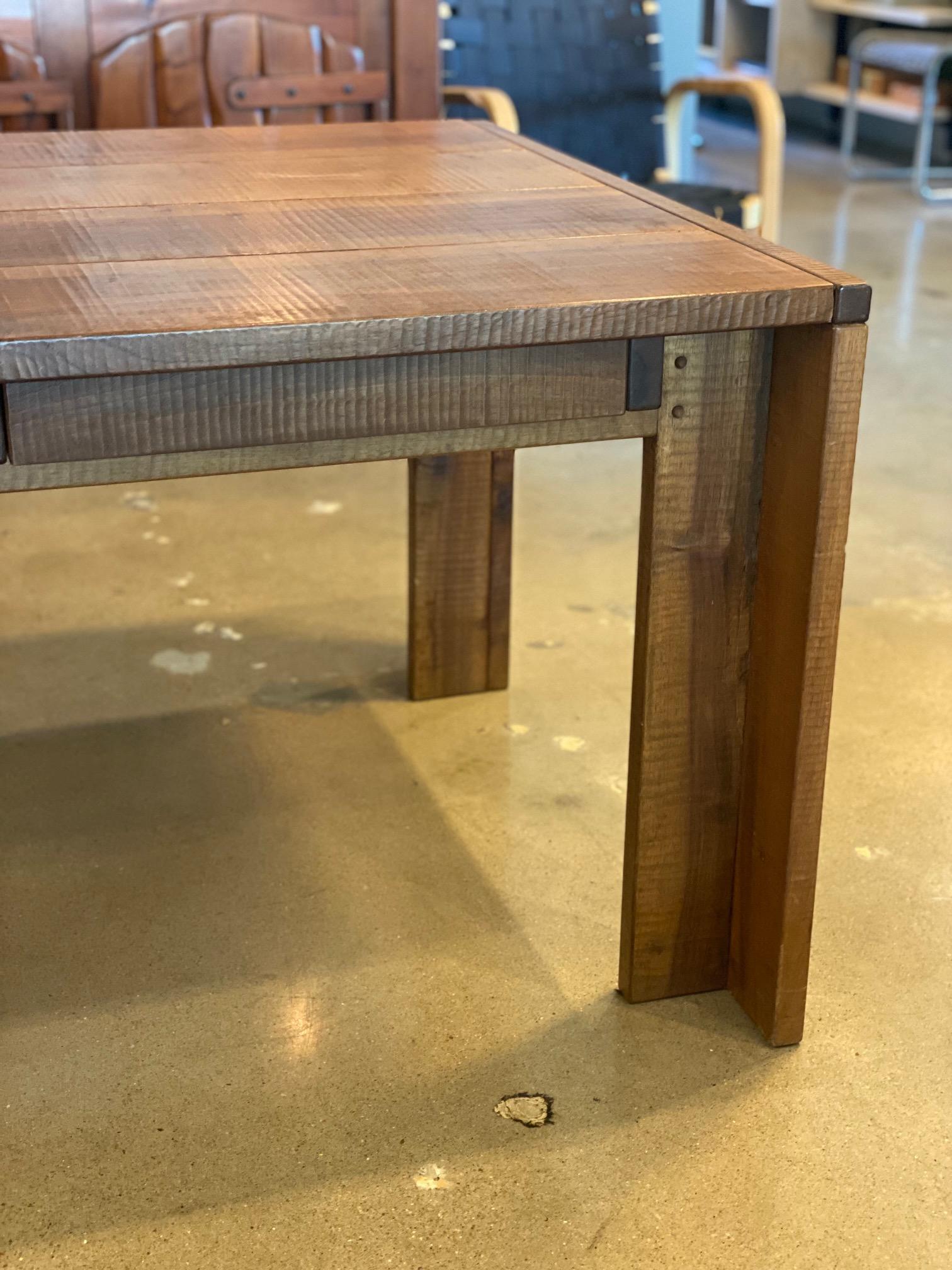 Rare and collectible executive desk in walnut plank by Giuseppe Rivadossi.  Solid construction throughout with creative joinery techniques.  Hand-planed exterior surface gives the walnut a slightly rippled texture which could be considered