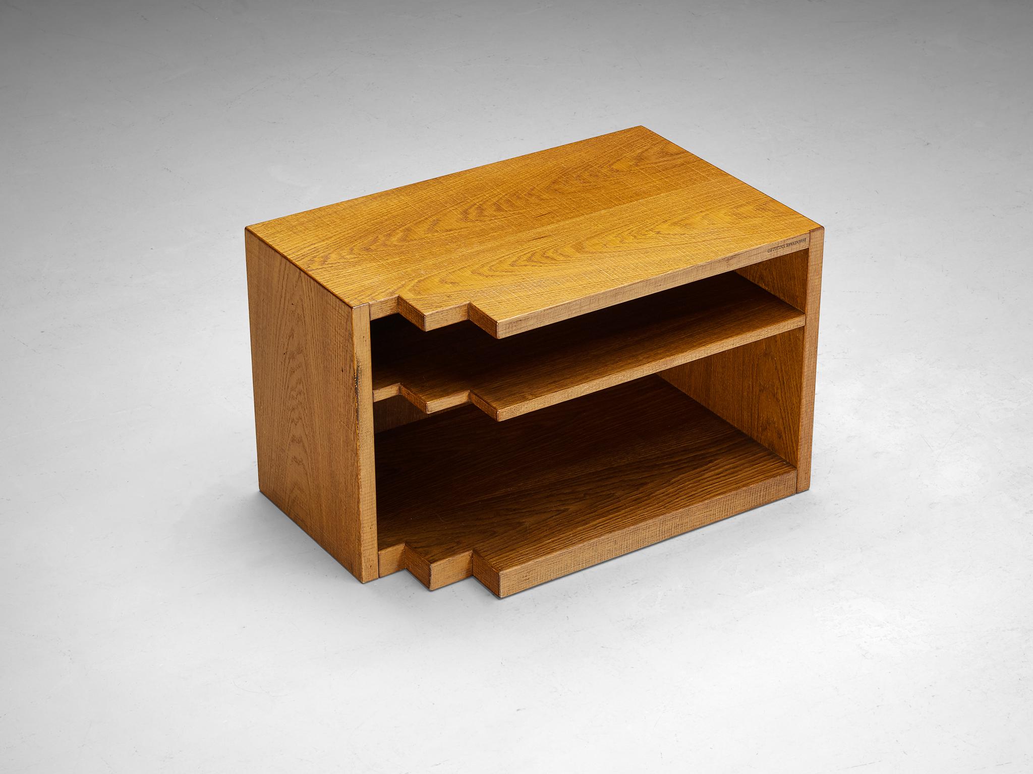 Giuseppe Rivadossi, side table, oak, Italy, 1970s

This delightful side table, designed by Italian sculptor and artisan Giuseppe Rivadossi, is a good example of woodworking artistry. Its striking design features a distinctive touch: on one side of