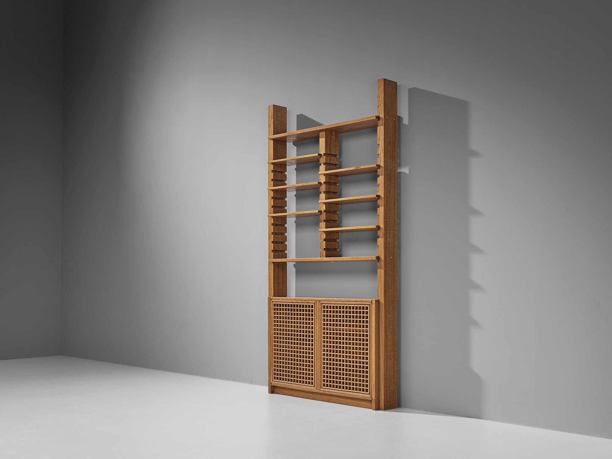Giuseppe Rivadossi for Officina Rivadossi, library or highboard, oak, Italy, 1980s

An exceptional wall unit by the Italian sculptor and designer Giuseppe Rivadossi, featuring a high-level of craftsmanship in woodwork. There are two cabinets