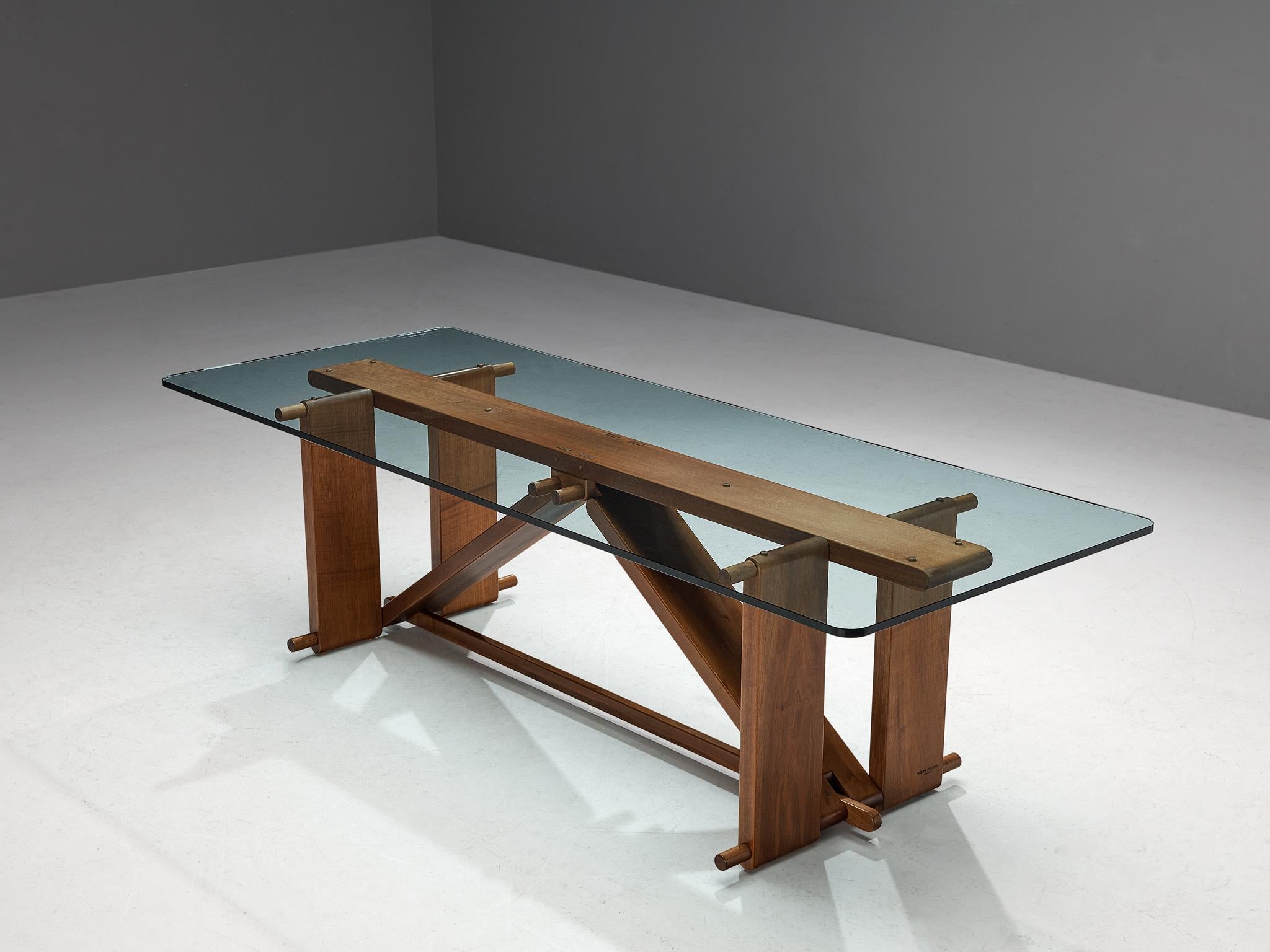 Giuseppe Rivadossi for Officina Rivadossi, dining table model 'Lombardo', walnut, glass, Italy, circa 1986.

Giuseppe Rivadossi once again proves his great eye for materialization and technicality this table is exemplary for. The table is