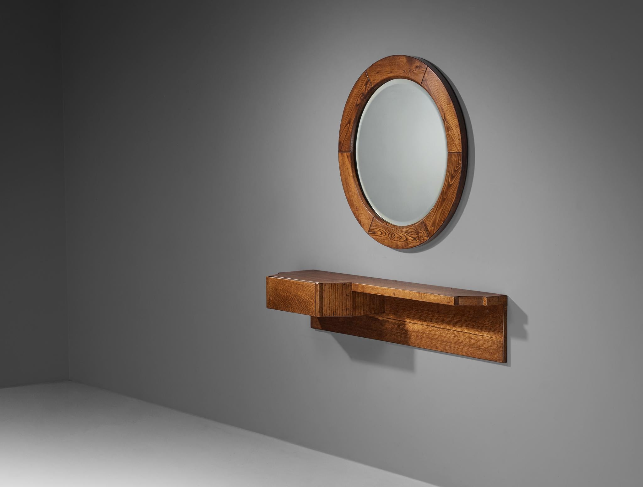 Giuseppe Rivadossi, wall-mounted console with mirror, oak, mirrored glass, Italy, 1970s

This stunning ensemble comprises a wall-mounted cabinet and a matching mirror, both designed by Italian sculptor and designer Giuseppe Rivadossi. The design
