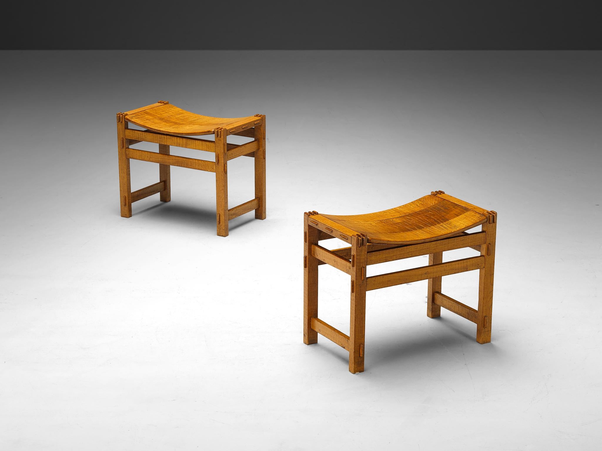 Giuseppe Rivadossi, pair of stools, oak, Italy, 1970s

This remarkable pair of stools, designed by Italian sculptor and artisan Giuseppe Rivadossi, is a testament to the artistry and craftsmanship inherent in fine woodworking. Constructed from
