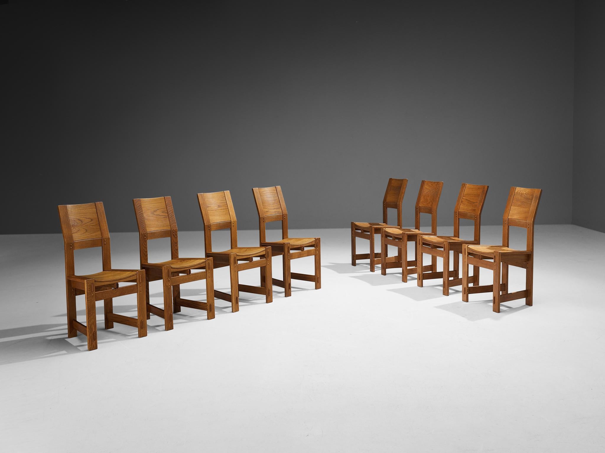 Giuseppe Rivadossi for Officina Rivadossi, set of eight dining chairs, oak, Italy, circa 1980

An exceptional set of chairs by the Italian sculptor and designer Giuseppe Rivadossi, featuring a high level of craftsmanship in woodwork. The chairs are