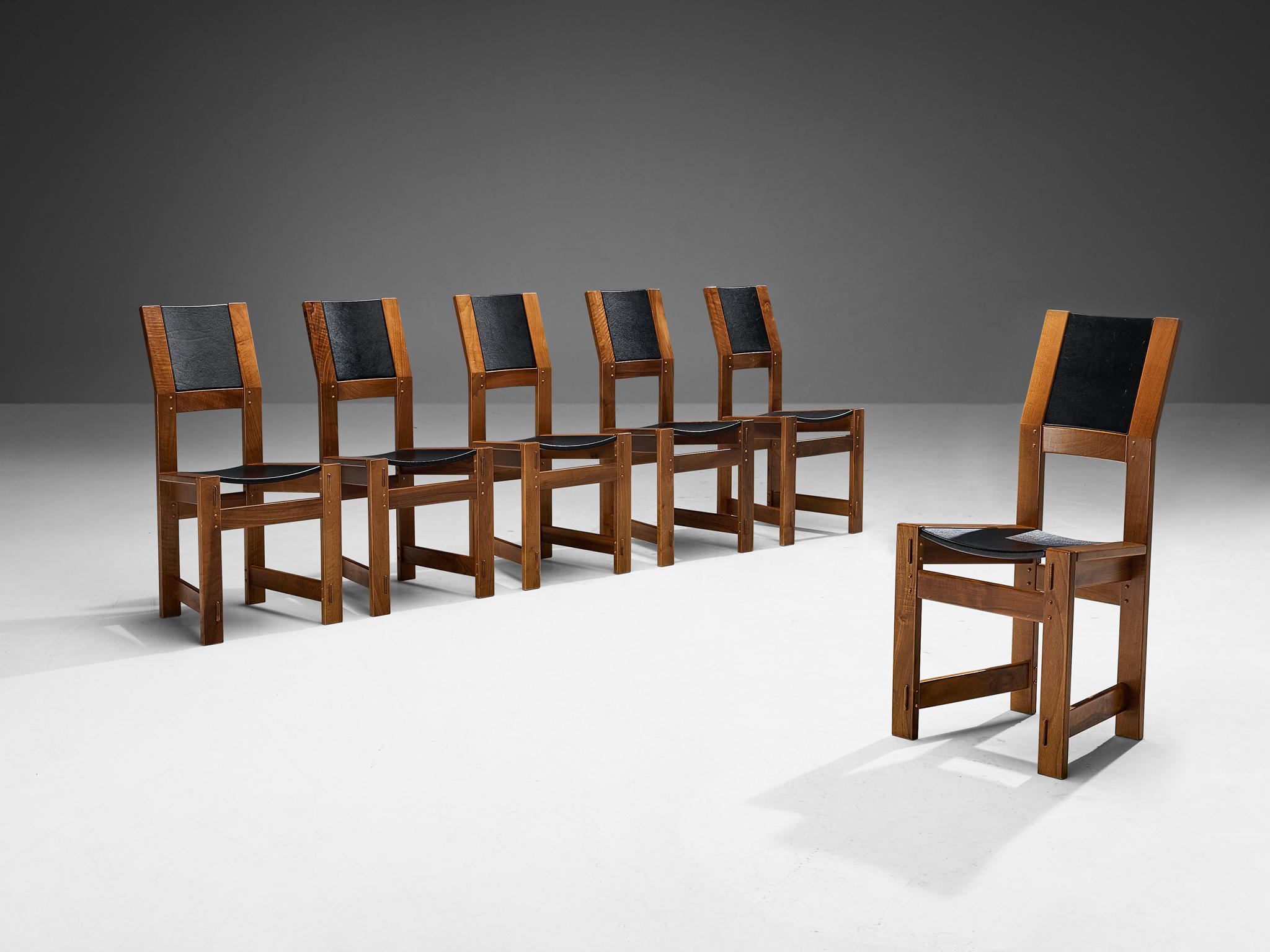 Giuseppe Rivadossi for Officina Rivadossi, set of six dining chairs, walnut, leatherette, Italy, circa 1980

An exceptional set of chairs by the Italian sculptor and designer Giuseppe Rivadossi, featuring a high level of craftsmanship in woodwork.