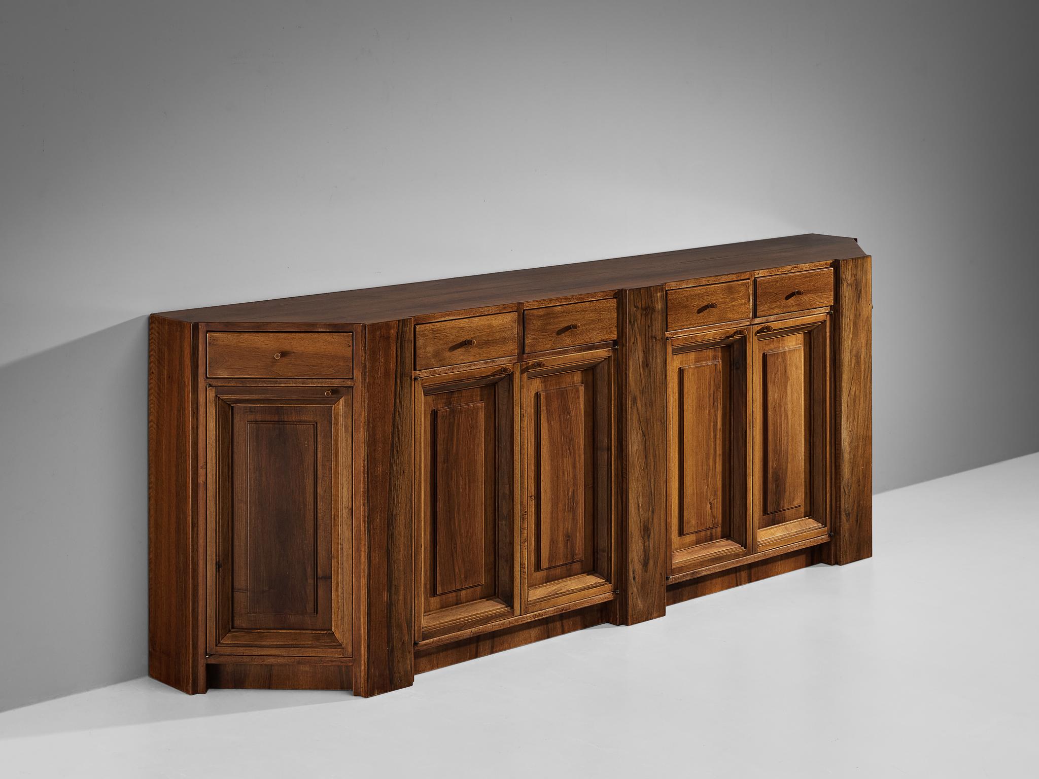 Giuseppe Rivadossi, sideboard, stained oak, Italy, 1960s

This striking sideboard by Giuseppe Rivadossi pleases the eye by all means. Rivadossi, an Italian sculptor and furniture designer, is known for his hand-carved wooden designs that combine a