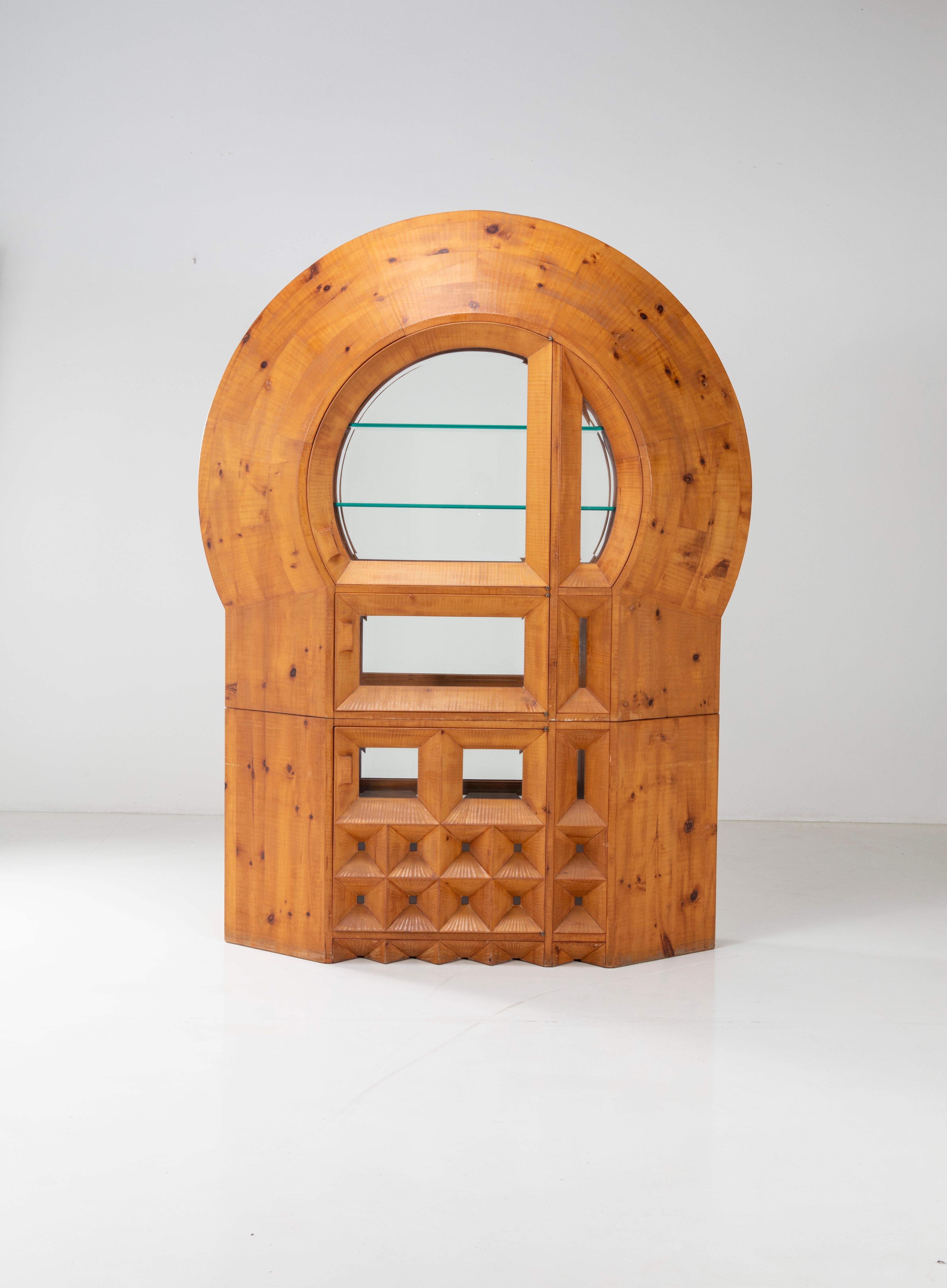 This is a unique, material, impressive and extremely decorative bar cabinet. The wood, reminiscent of the mountains, is hand-finished and the chisel grooves can be seen distinctly enriching the outline. The glass windows with the two doors, in the