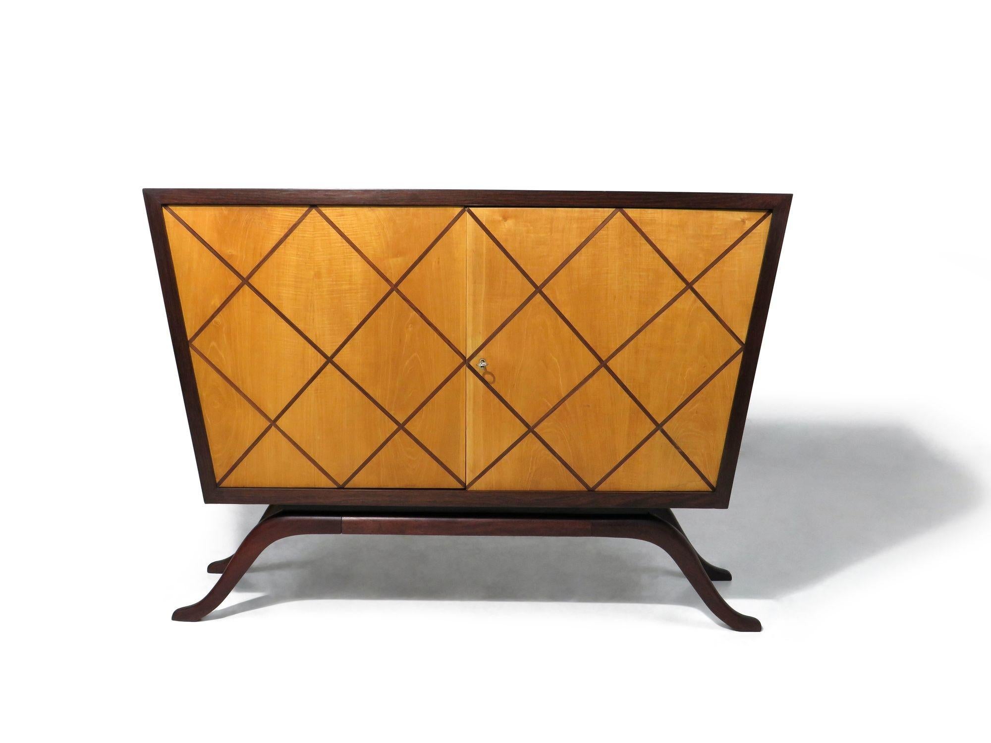 Brazilian bar cabinet designed by Guiseppi Scapinelli crafted of a dark rosewood frame, locking Pau Marfim doors with inlaid diamond pattern of rosewood and raised on dramatic curved legs of solid Brazilian rosewood. This unique, and rare cabinet