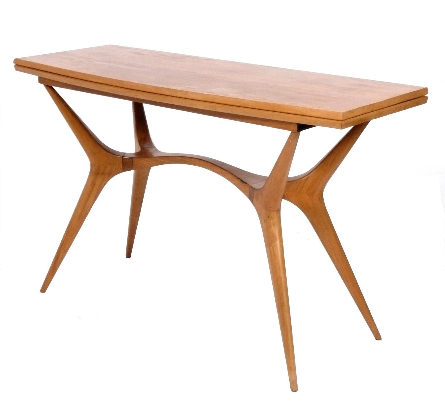 Sculptural Flip Top Console / Dining Table, designed by Giuseppe Scapinelli, Brazil, circa 1950s. We originally thought this table was a Vladimir Kagan design when we first saw it, due to the swooping sculptural legs. We were surprised to find the