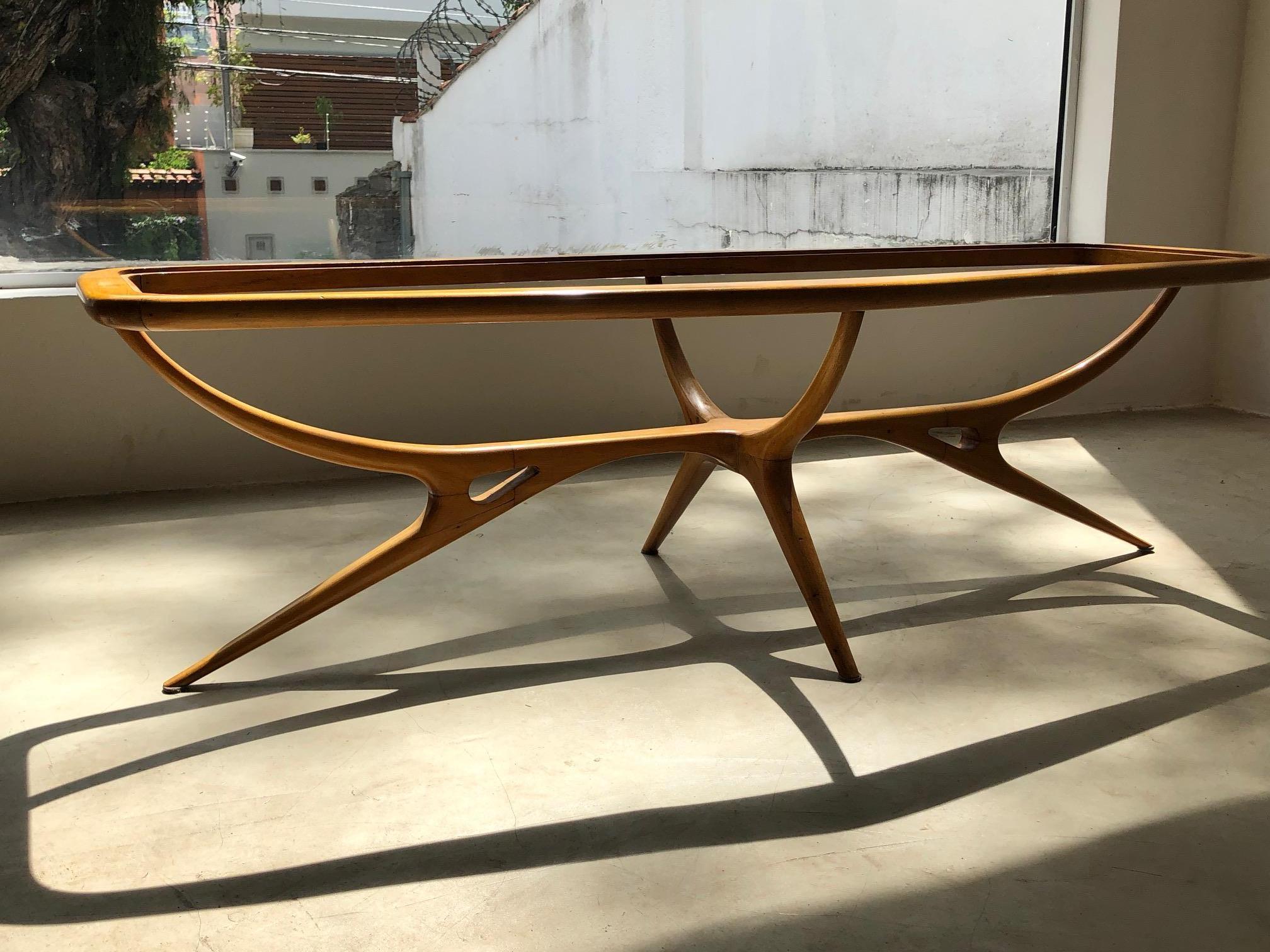 Giuseppe Scapinelli. Amazing biormorphic shaped Brazilian modern design furniture item. This coffee is table made of solid pau marfim wood with glass top. A 1950s design that reaches the level of an work of art.