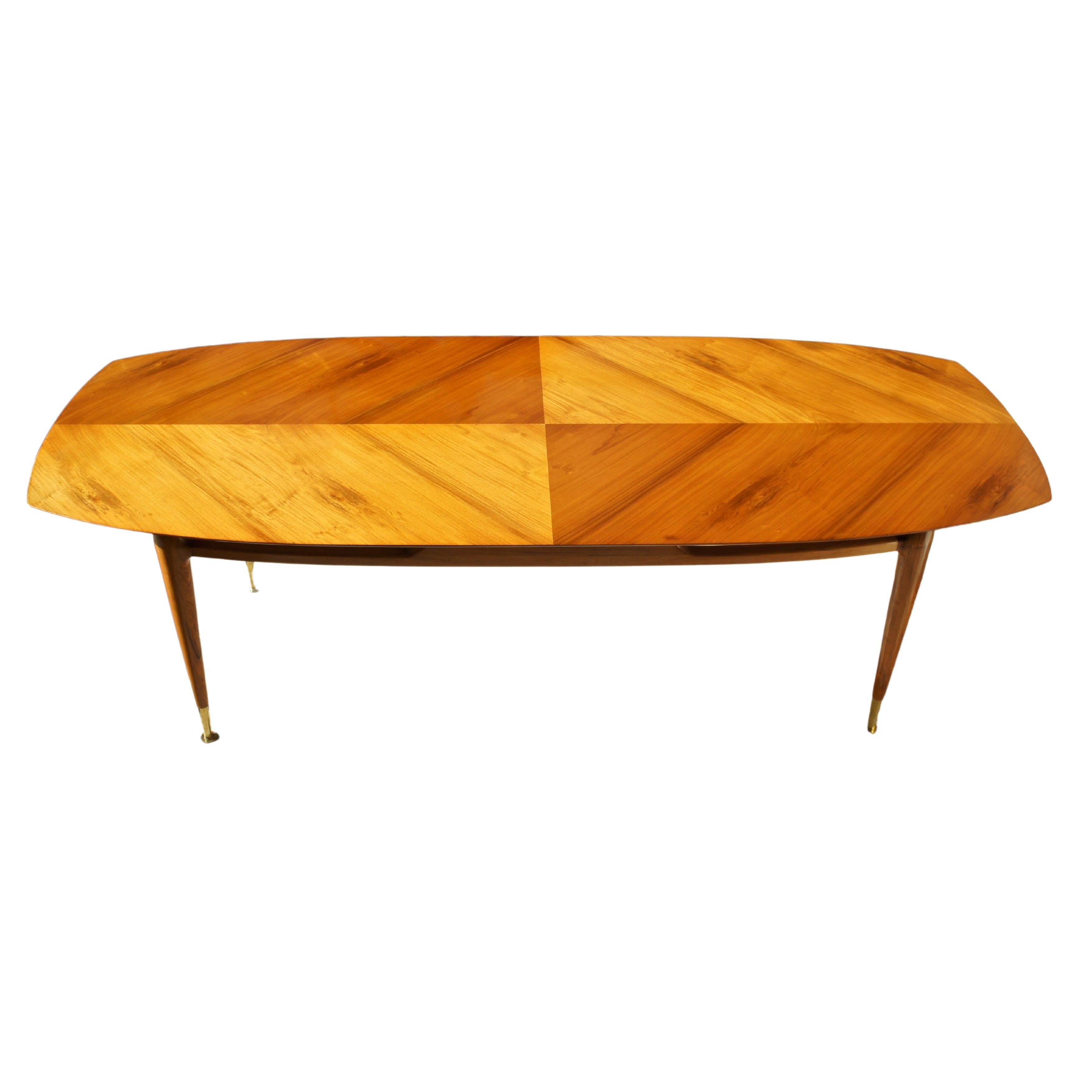 Extraordinary and unique dining table. Its structure is made of solid caviuna; the table top has a caviuna finishing with brass details. This is definitely a masterpiece by Scapinelli.

This table was photographed for the book 
