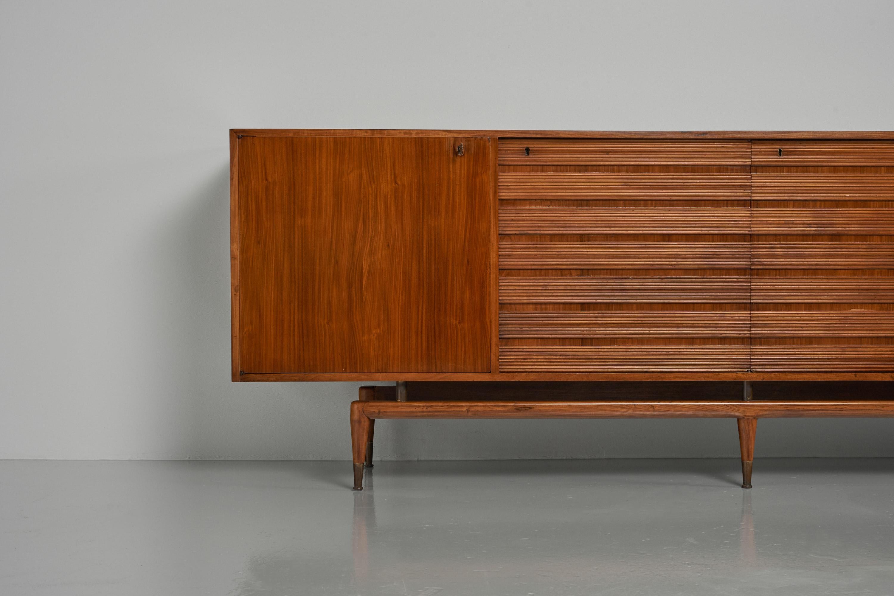 Large sized sideboard designed by Giuseppe Scapinelli and manufactured by Jacques Pedrolli, Brazil 1950. This amazing shaped sideboard has the appeal of a drawer’s cabinet, where in fact the 3 parts where you think the drawers are, are normal