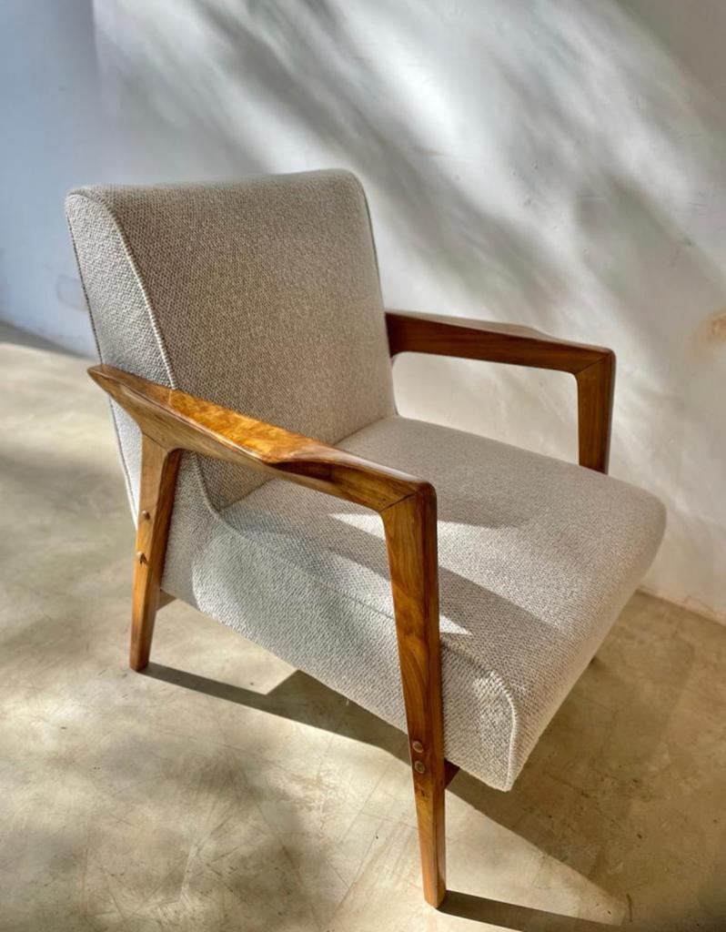 A pair of vintage Brazilian modern design armchairs made for the Nacional Hotel in Brasília in solid caviúna wood.
