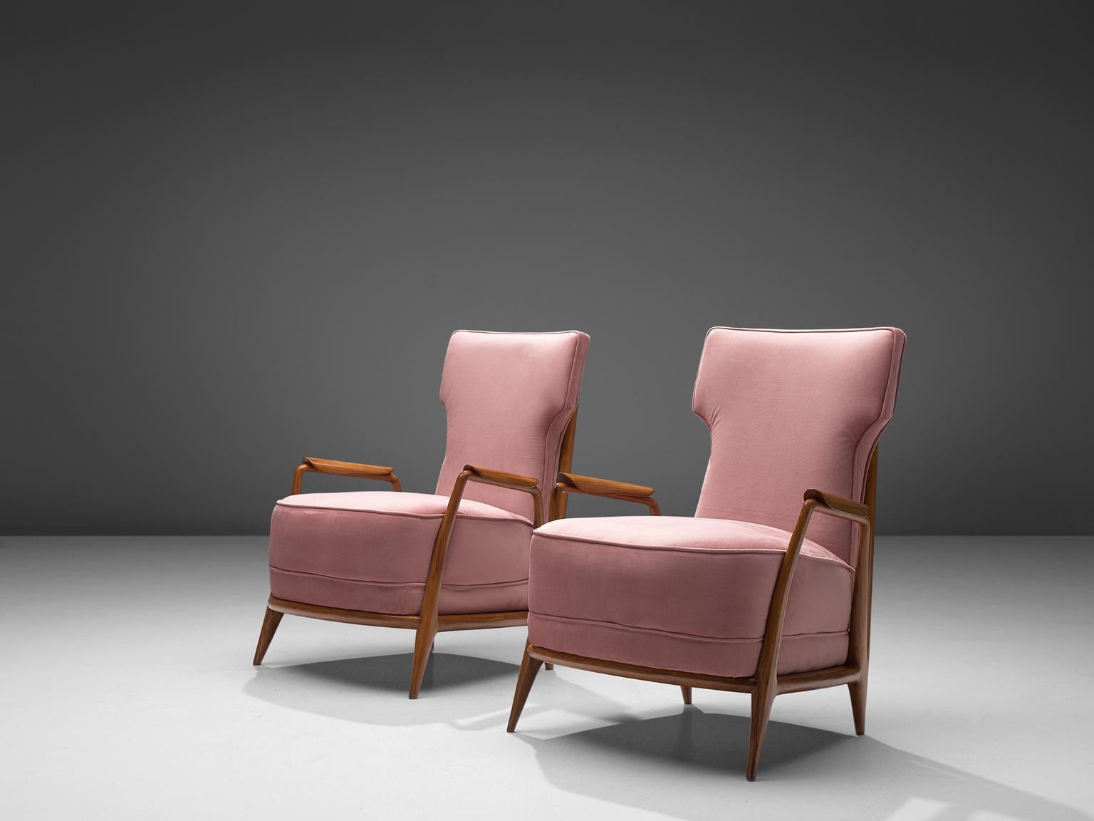 Giuseppi Scapinelli, set of 2 lounge chairs in caviuna wood and pink suede, 1950s, Brazil.

Elegant easy chairs with spoke back. This chair in caviuna wood exposes the beautiful grain of the wood in an eloquent manner. This chair is one of