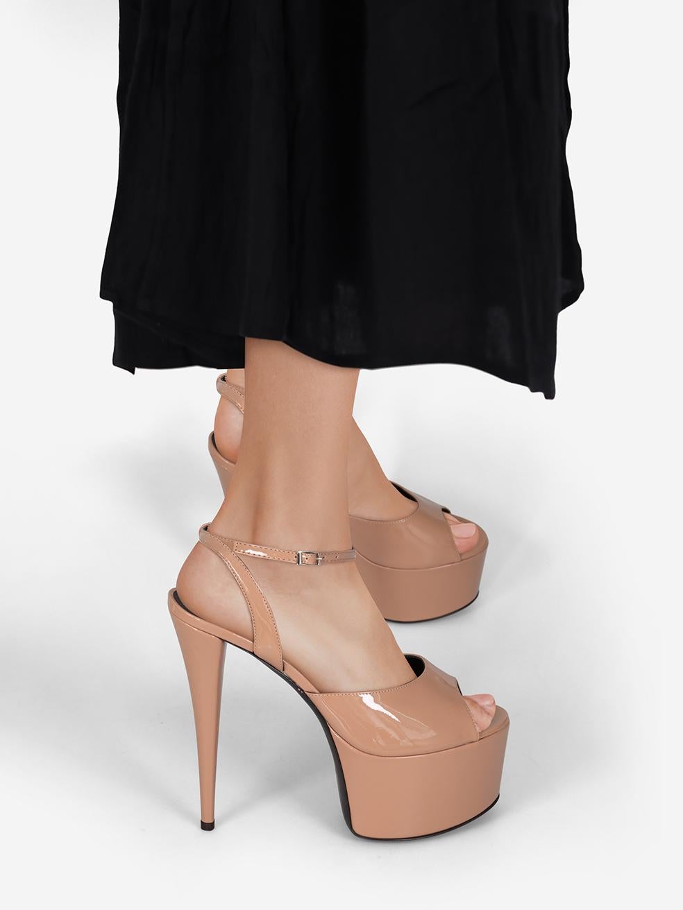 CONDITION is New with tags on this brand new Giuseppe Zanotti designer item. This item comes with original packaging.
 
 
 
 Details
 
 
 E300059
 
 Model: Aida
 
 Beige
 
 Patent
 
Heels
 
 Open toe
 
 Ankle strap fastening
 
 Platform
 
 High