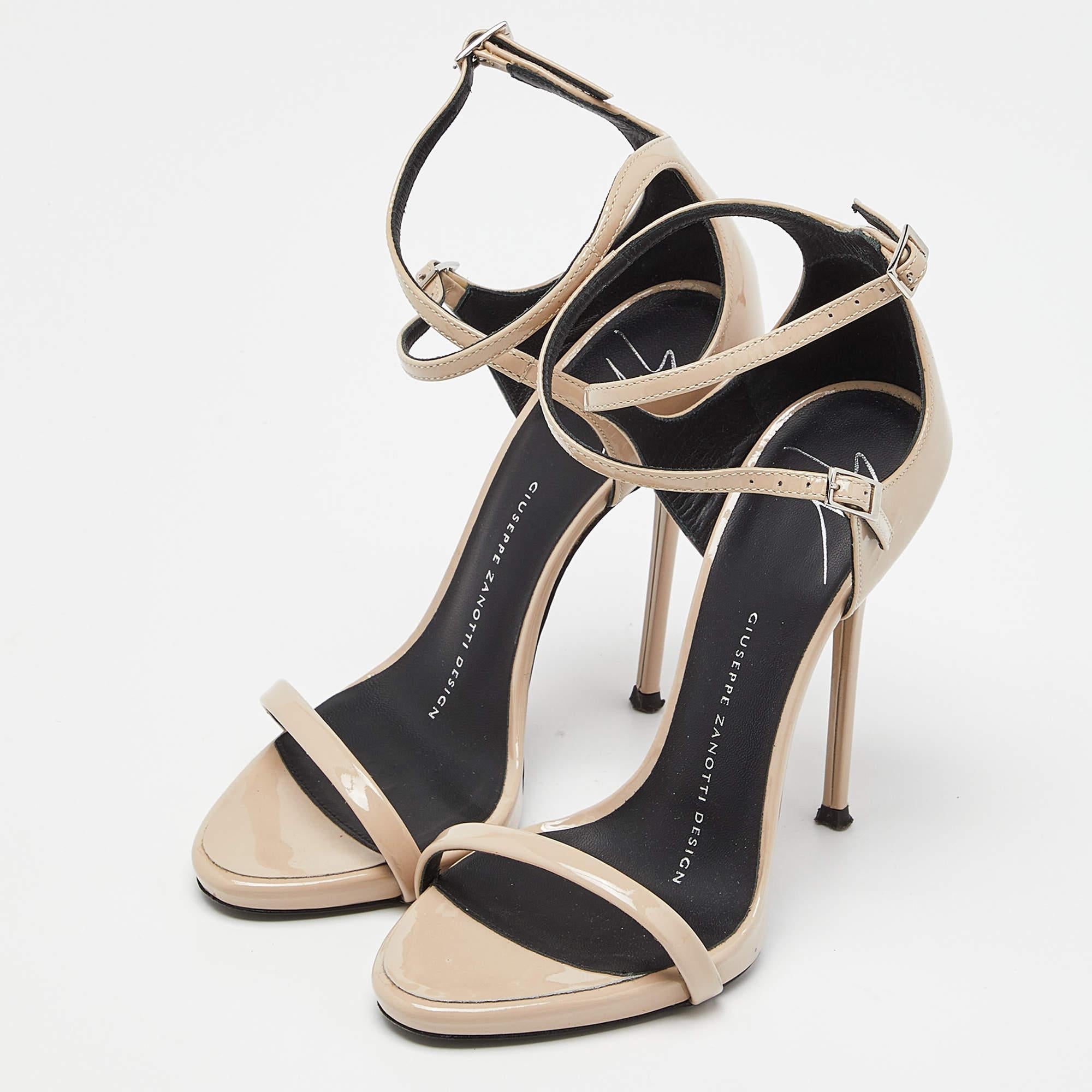 A perfect mix of elegant fashion and sensuous style, these Giuseppe Zanotti sandals come designed with three patent leather straps on each other. They are visually stunning and they stand tall on 12cm heels.


