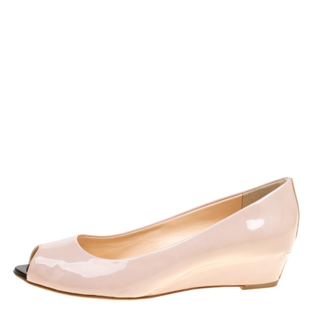 These pumps from Giuseppe Zanotti will be ideal for workwear or for other occasions. They are crafted from beige patent leather and feature peep toes and short wedge heels. The pumps are well-made and easy to flaunt.

Includes: The Luxury Closet