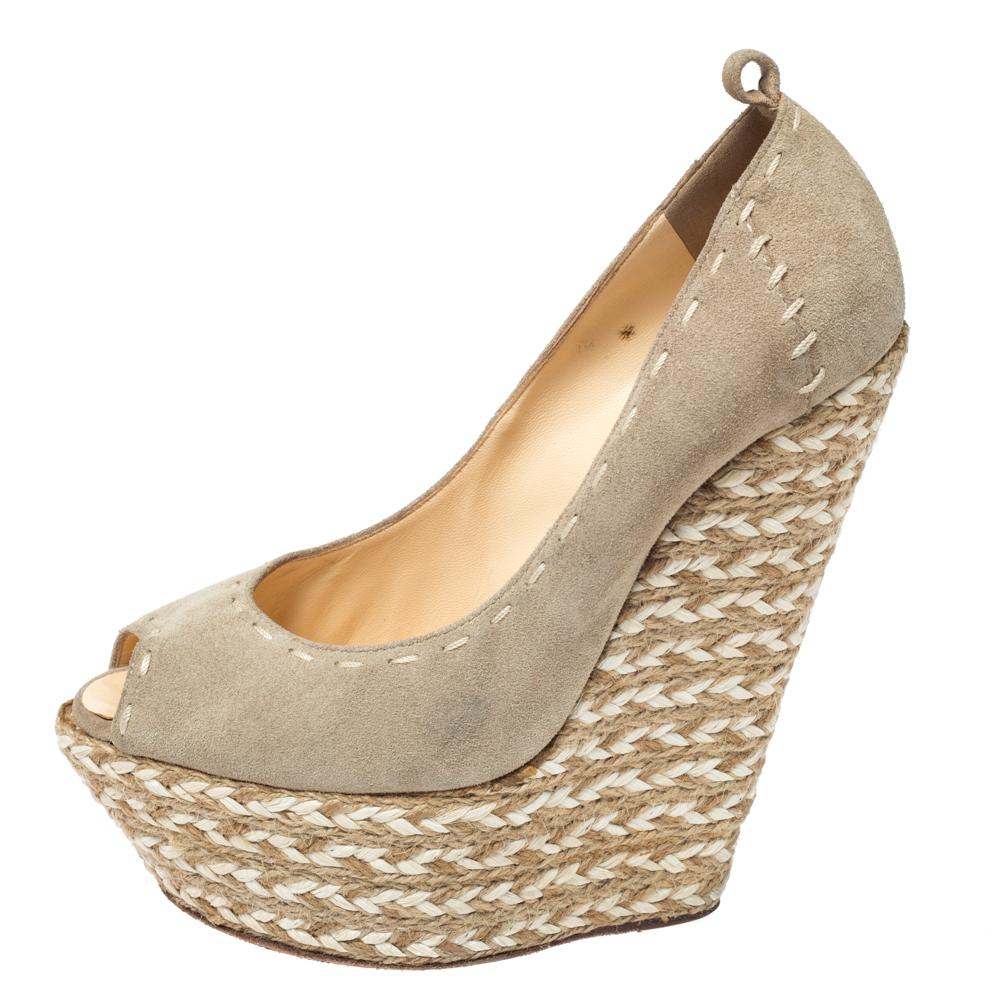 This pair of wedge sandals by Giuseppe Zanotti is lovely. They have been wonderfully styled with peep toes, ankle straps and are elevated on 16 cm espadrille wedges. Complete with comfortable leather insoles, this pair is a must-have.

Includes: