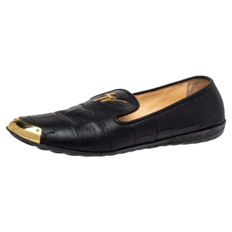 Loafers never looked so stylish, thanks to these ones from Giuseppe Zanotti. The black loafers are crafted from croc-embossed leather, styled with gold-tone metal details on the front toe base, and endowed with comfortable insoles. Perfect