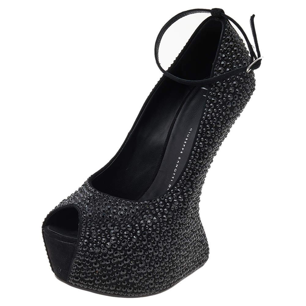 Walk in style and make the streets your fashion runway with these spectacular pumps from Giuseppe Zanotti. The pumps are meticulously crafted from suede and designed with peep toes, ankle straps, and crystals all over. To top it off, the pair is