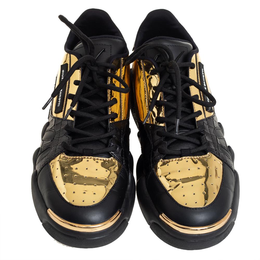 Perfect for a trendy look, these stylish sneakers from the house of Giuseppe Zanotti are crafted using leather and croc embossed leather. They come in black and gold hues and lace-up detail. The classic 'Giuseppe Zanotti' logo on the side elevates