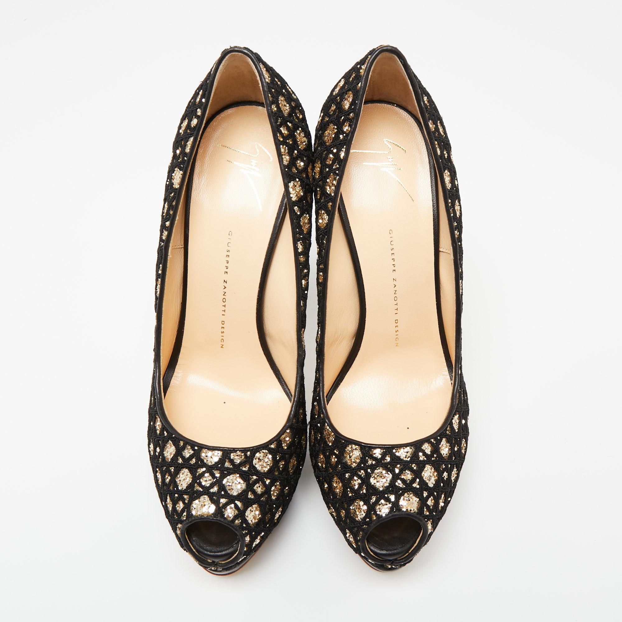 These gorgeous black and gold pumps from Giuseppe Zanotti are set on solid platforms and towering 16 cm heels. They have been crafted from glitter and fabric and styled with peep-toes. They are complete with comfortable leather-lined insoles and