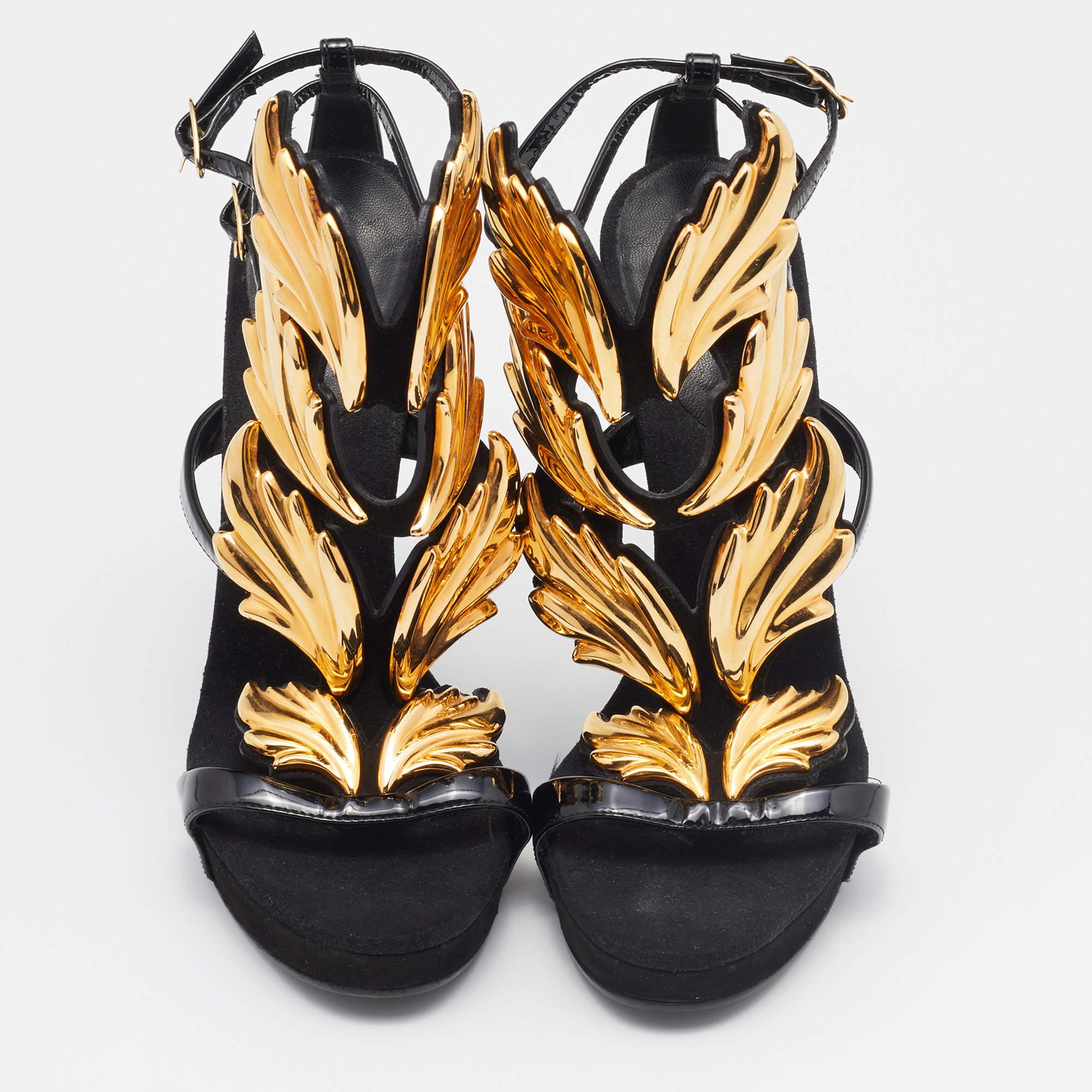 These exquisite sandals feature a striking blend of patent leather and gold accents paired with soft suede detailing. With their sleek design and luxurious materials, they are the perfect statement piece for any summer ensemble.

