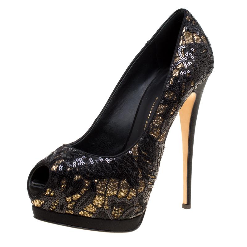 With such a gorgeous and dazzling pair as this Giuseppe Zanotti one, you are sure to receive never ending compliments! Designed in a peep-toe silhouette, the black pumps are crafted from lace and glitter fabric and are beautifully embellished with