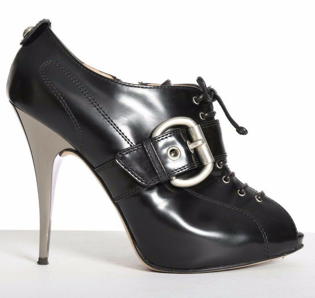 GIUSEPPE ZANOTTI black lace up buckled mirrored heels booties EU38 US8 UK5
GIUSEPPE ZANOTTI
Black leather upper . 
Lace up detail front . 
Faux strapped silver buckle detail across front . 
Peep toe with hidden platform . 
Silver charm at back