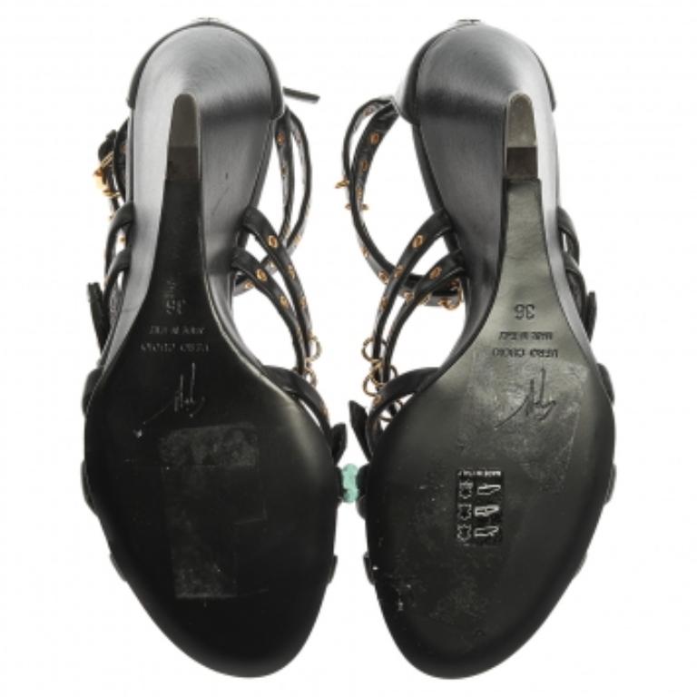 These Giuseppe Zanotti sandals will bring you the perfect amount of style and comfort. They are crafted from black leather in a strappy silhouette and detailed with gold-tone buckles and eyelets. They feature ankle straps, zippers on the heel