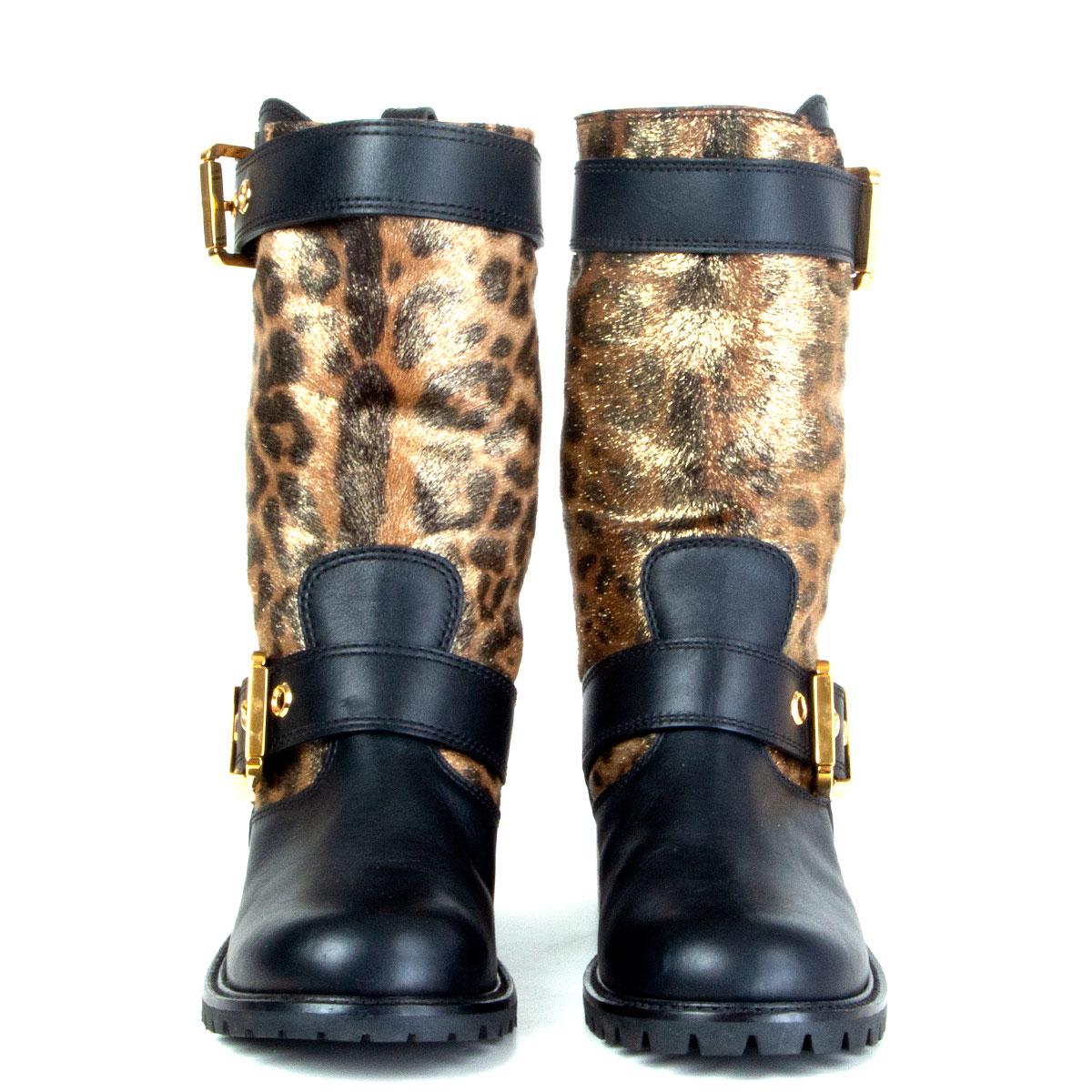 authentic Giuseppe Zanotti biker boots in gold-tone metallic leopard-print calf-hair and black calfskin. Two gold-tone metal buckles on the side. Black rubber sole. Have been worn and are in excellent condition. 

Imprinted Size 37
Shoe Size