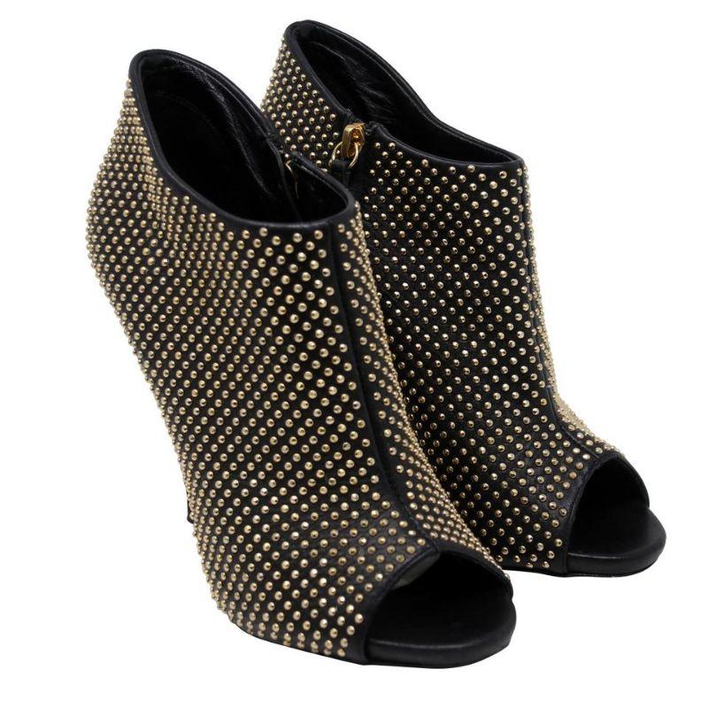 Giuseppe Zanotti Black Leather Gold Studded Boots/booties

These Giuseppe booties are the perfect match for you! They are in good condition with only minor use. Leather is in good condition with no rips. Missing stud on left shoe. ( please look at
