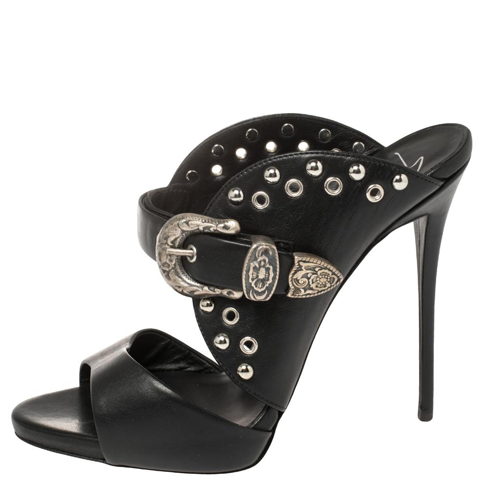 We're greatly impressed by these slide sandals from Giuseppe Zanotti! They are crafted from black leather into an open-toe silhouette and styled with eye-catching buckle, grommet, and stud details. Comfortable leather-lined insoles and 12.5 cm
