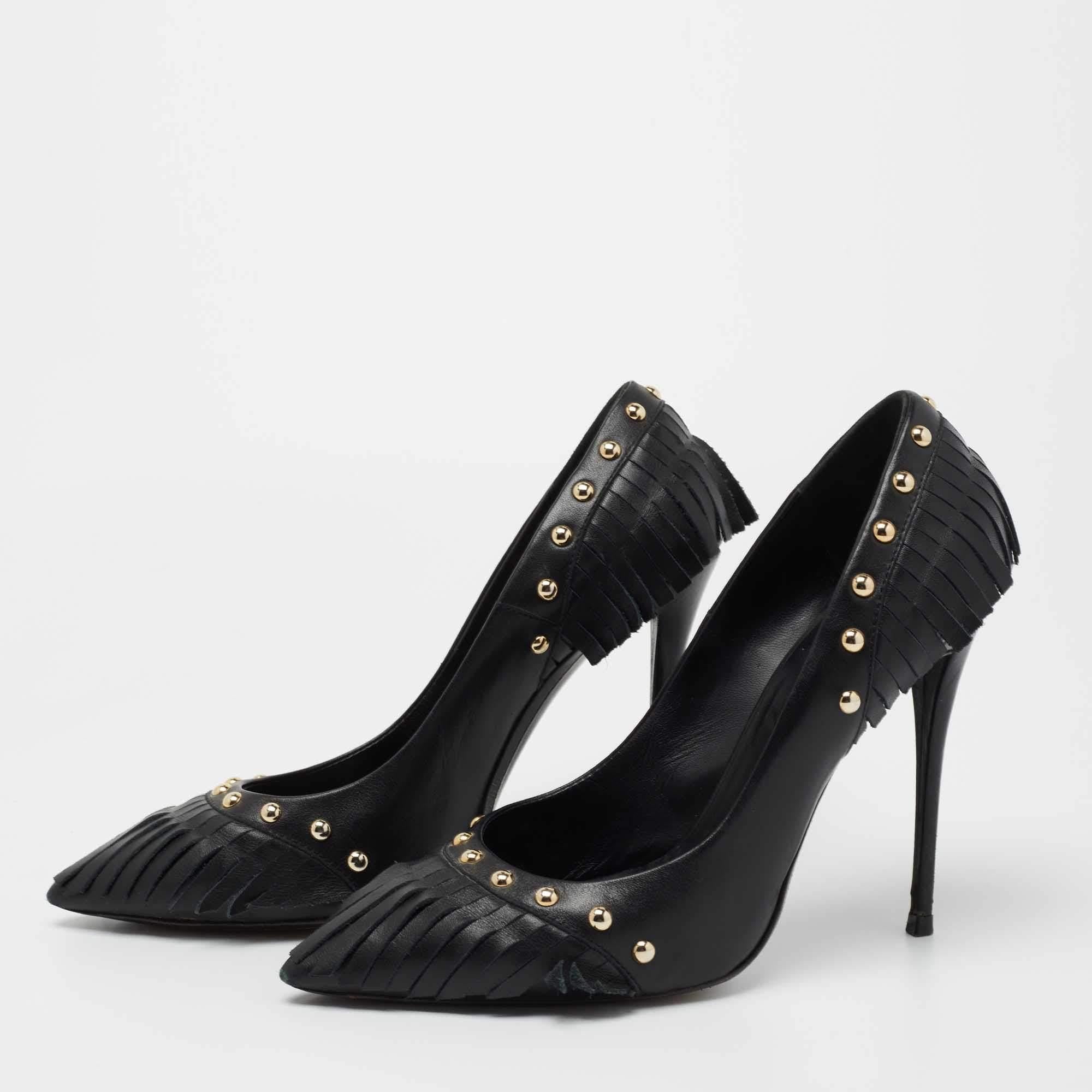 These perfect party pumps by Giuseppe Zanotti are made from black leather. They come with pointed toes and are designed with gold-tone studs and fringed details. Lined with leather, they stand tall on 12 cm slim heels.

