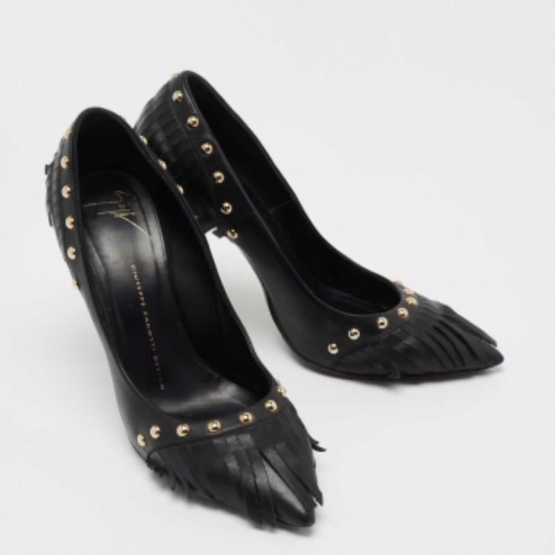 These perfect party pumps by Giuseppe Zanotti are made from black leather. They come with pointed toes and are designed with gold-tone studs and fringed details. Lined with leather, they stand tall on 12 cm slim heels.