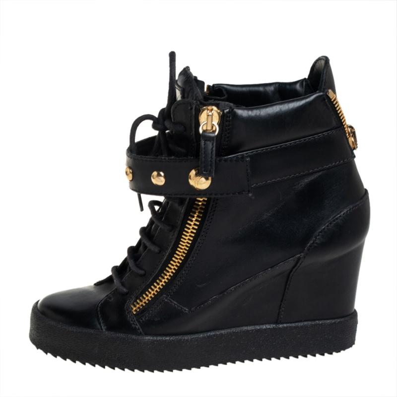 These sneakers by Giuseppe Zanotti are meant to be flaunted. Crafted from leather, they feature a gorgeous design of gold-tone zipper details on the front and at the rear. The black pair is beautifully completed with concealed wedges and studded