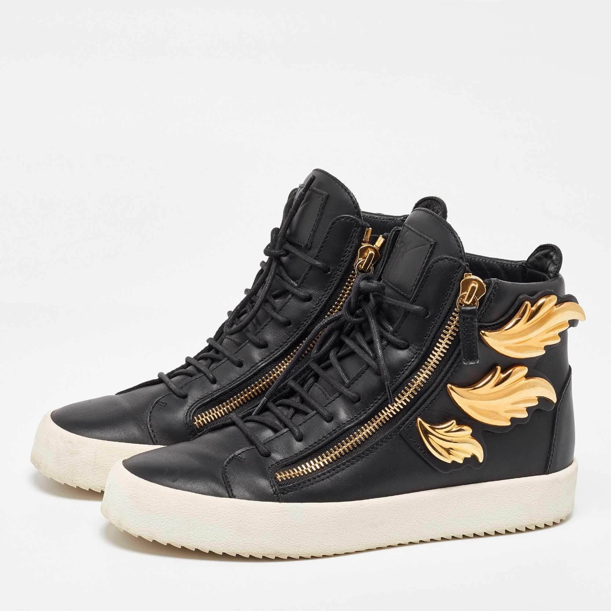 Zanottis shoes epitomize the synthesis of creative design and impeccable Italian craftsmanship. Featuring gold tone metal wing details on the sides these signature double zipped Giuseppe Zanotti sneakers are hard to miss. The high top styling with