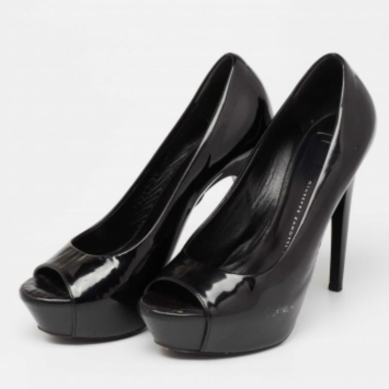 You can never go wrong with these stunning Giuseppe Zanotti pumps. Crafted in Italy, they are made from patent leather and come in a black shade. They are styled with peep toes, platforms, tall heels, and a good fit. They are finished with leather