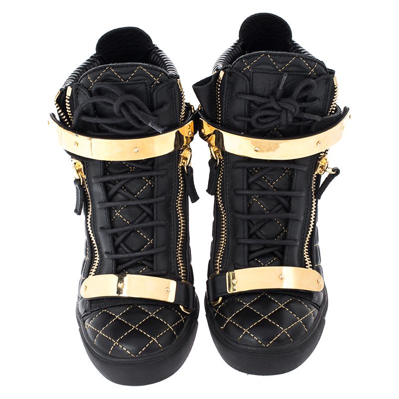 These sneakers by Giuseppe Zanotti are meant to be flaunted. Crafted from leather, they feature a quilted exterior with gold-tone zipper details on the front and at the rear. The pair is beautifully completed with concealed wedges and gold-tone