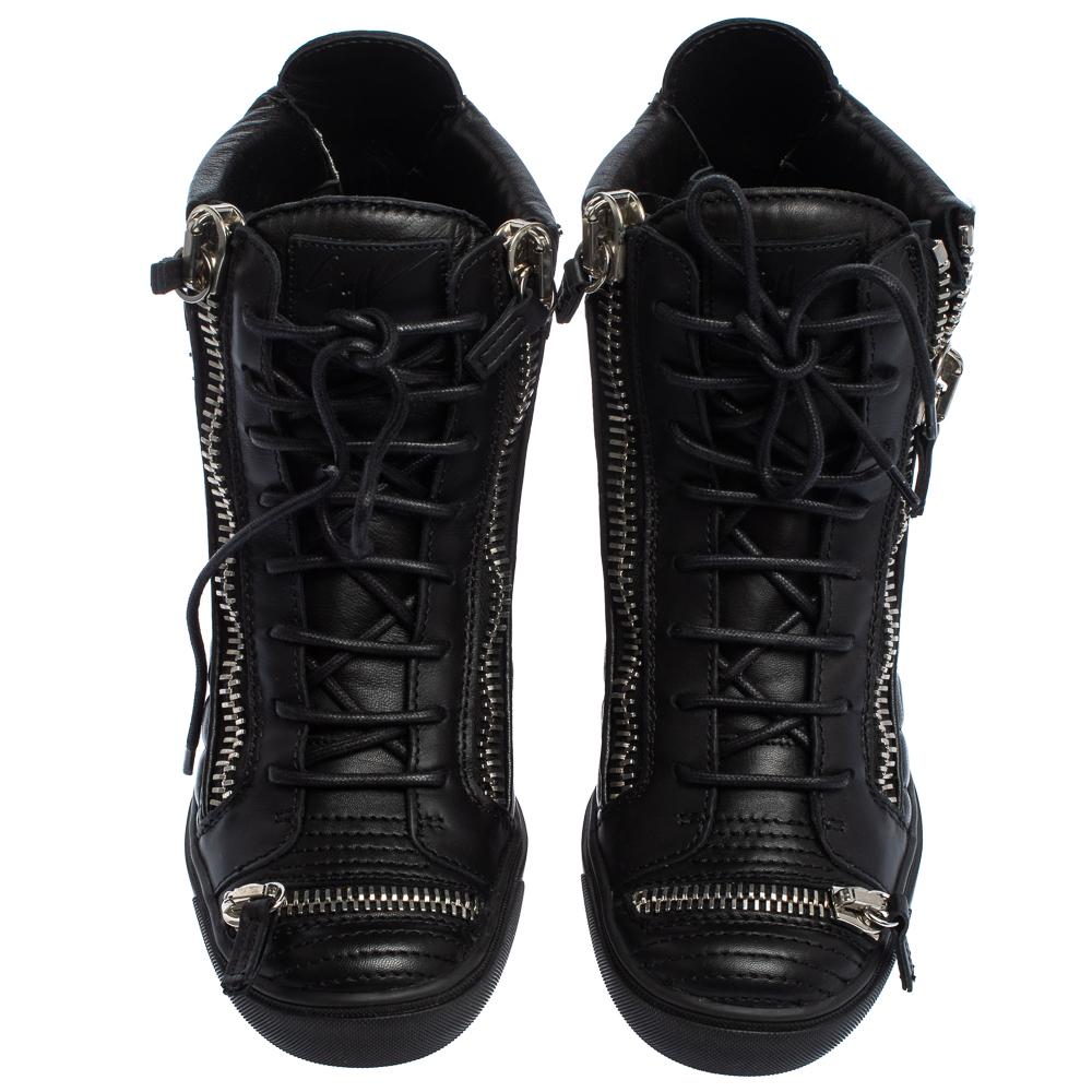 These sneakers by Giuseppe Zanotti are meant to be flaunted. Crafted from leather, they feature a quilted exterior with silver-tone zipper details on the front and at the rear. The pair is beautifully completed with concealed wedges, lace-ups, and