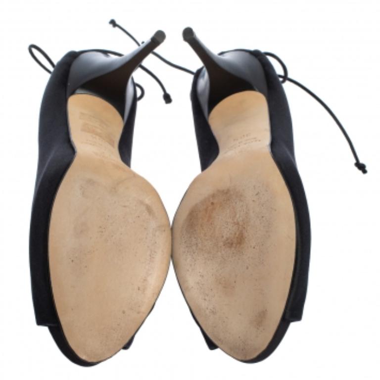 Those stylish outfits will look a lot more appealing with these bold pumps from Giuseppe Zanotti. They have been crafted from black satin into a peep-toe silhouette and styled with knotted ties on the counters. They are made comfortable with