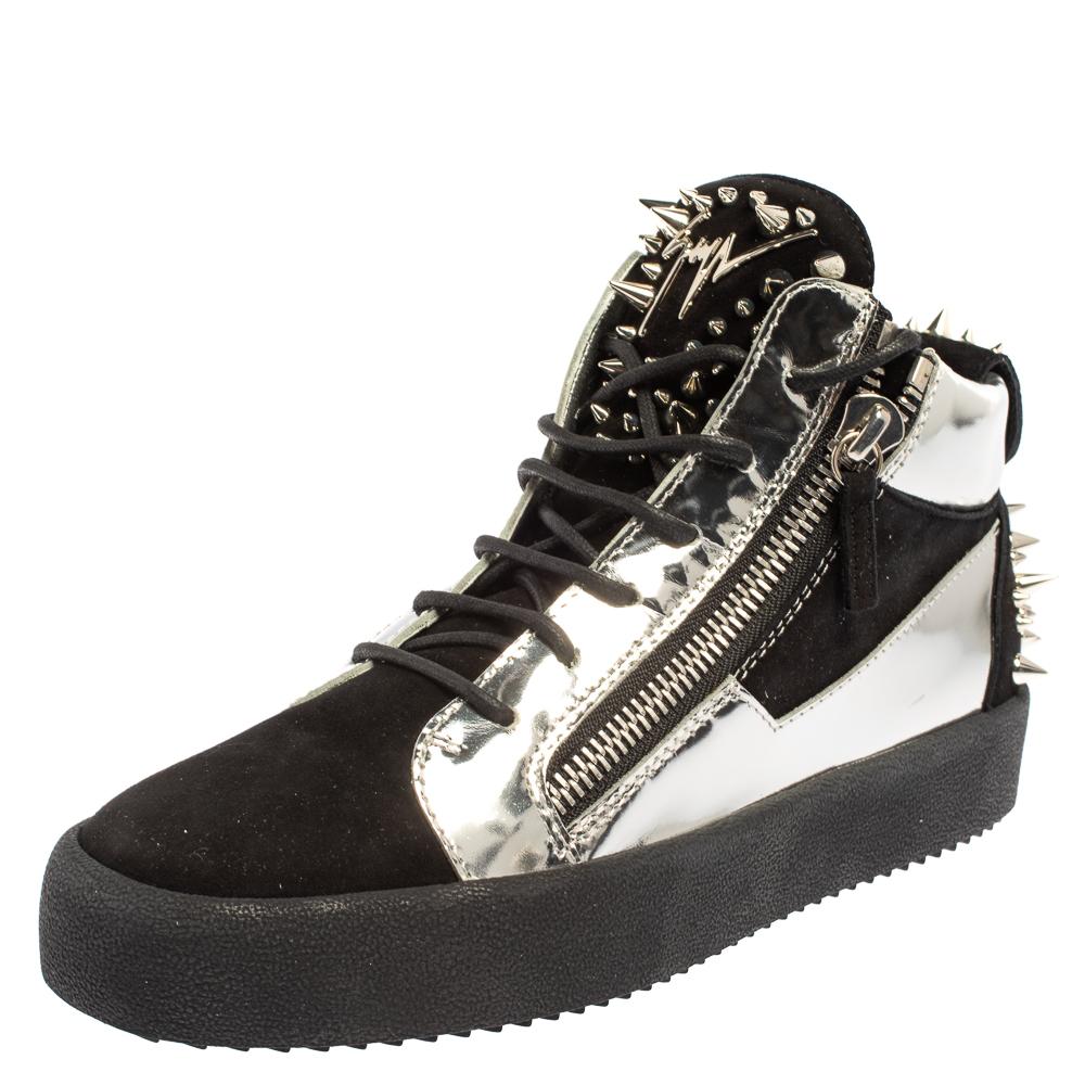 Let these Giuseppe Zanotti sneakers help you make a fashion statement. Crafted in Italy, they are made of black suede as well as silver patent leather and decorated with studs. They come with lace-up fronts, brand detail on the tongue, double zip