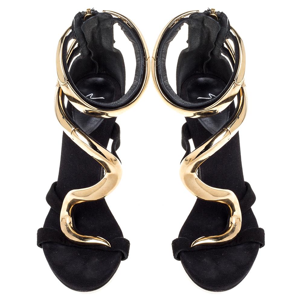 Rock these Giuseppe Zanotti 'Alien' sandals on your night outings. These edgy sandals come with 11.5 cm high heels and zipper fastenings at the backs. They feature a strappy silhouette and gold-tone hardware detailing on the vamps. The insoles are