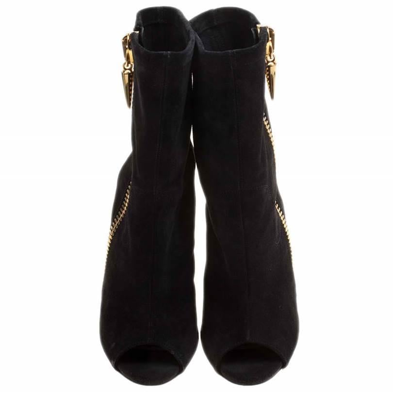 If it's a Zanotti, it is without a doubt, worth owning. Giuseppe's designs come with a style that leaves all in awe. Take a look at these ankle boots! They've been crafted from suede and styled with gold-tone zippers, peep toes, open counters and 13