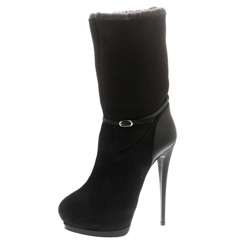 The search for those perfect boots ends with these gorgeous ones from Giuseppe Zanotti! These black boots have been crafted from suede and styled with leather. They come with buckle details, fur lining, and 15.5 heels supported by solid platforms.