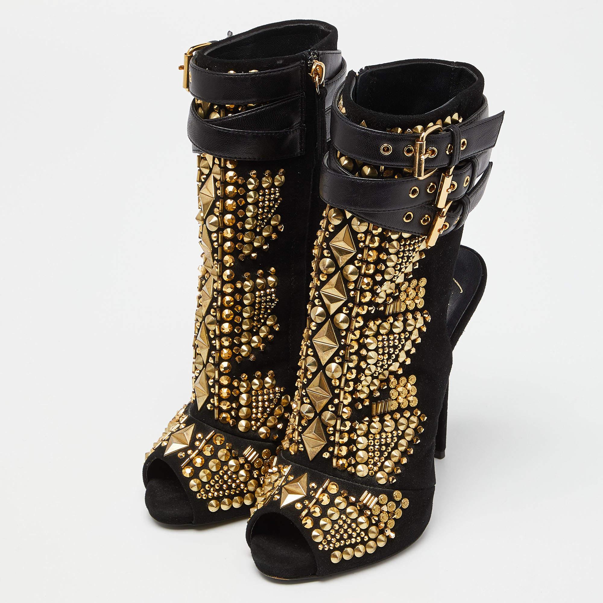 Make a statement in these Giuseppe Zanotti ankle boots. They're crafted from suede & leather in a peep-toe silhouette and embellished with gold-tone metal accents. Open counters, buckles, and slim heels complete them.

